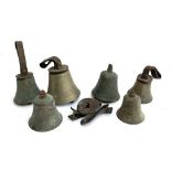 Various brass hand bells, several with leather handles intact (6)