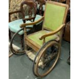 An early 20th century wheelchair, bears label for A.C Daniels, London
