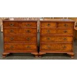 A pair of reproduction burr walnut veneer chest of drawers, each with moulded top over two short and
