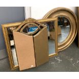 A circular gilt framed mirror with bevelled glass, 69cmD; together with a rectangular wall mirror