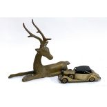 A brass figure of a stag, 27cmH, together with a model of a vintage car
