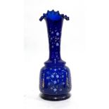 A cobalt blue glass vase with shaped rim, painted and gilt decoration, 34.5cmH