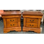 A pair of modern bedside cabinets, moulded tops of two drawers, each 60x45x61cmH