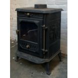 A small woodburning stove, 45x33x63cmH; together with a large quantity of fire tools