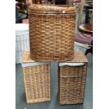 Two square section wicker laundry baskets with liners, each 58cmH; together with one other 56cmH