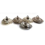 A set of 4 plated lidded entree dishes, each with gadrooned borders, plus one other smaller