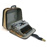 An Olympia deluxe typewriter in soft carry case