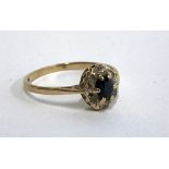 A 9ct gold and sapphire ring set with diamond chips, size N.5, approx. 1.4g