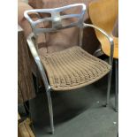 An Aluminium 'Alutec' cafe chair with wicker style seat