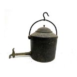 A hanging cast iron kettle with tap, 44cmH to top of handle