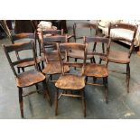A harlequin set of eight 19th century Thames Valley kitchen chairs, some stamped with initials, some