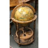 A drinks cabinet in the form of a terrestrial globe, on casters, 93cmH