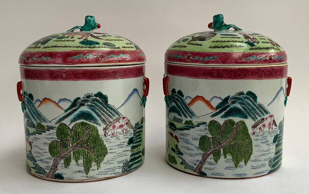 A pair of Chinese famille rose lidded pots depicting horses is a mountainous landscape, each with - Image 2 of 3