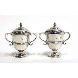A pair of silver peppers, by William Hutton & Sons, London 1896, 6.5cmH