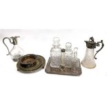 A quantity of plated items to include several salvers, a heavy plated wine coaster, cut glass claret