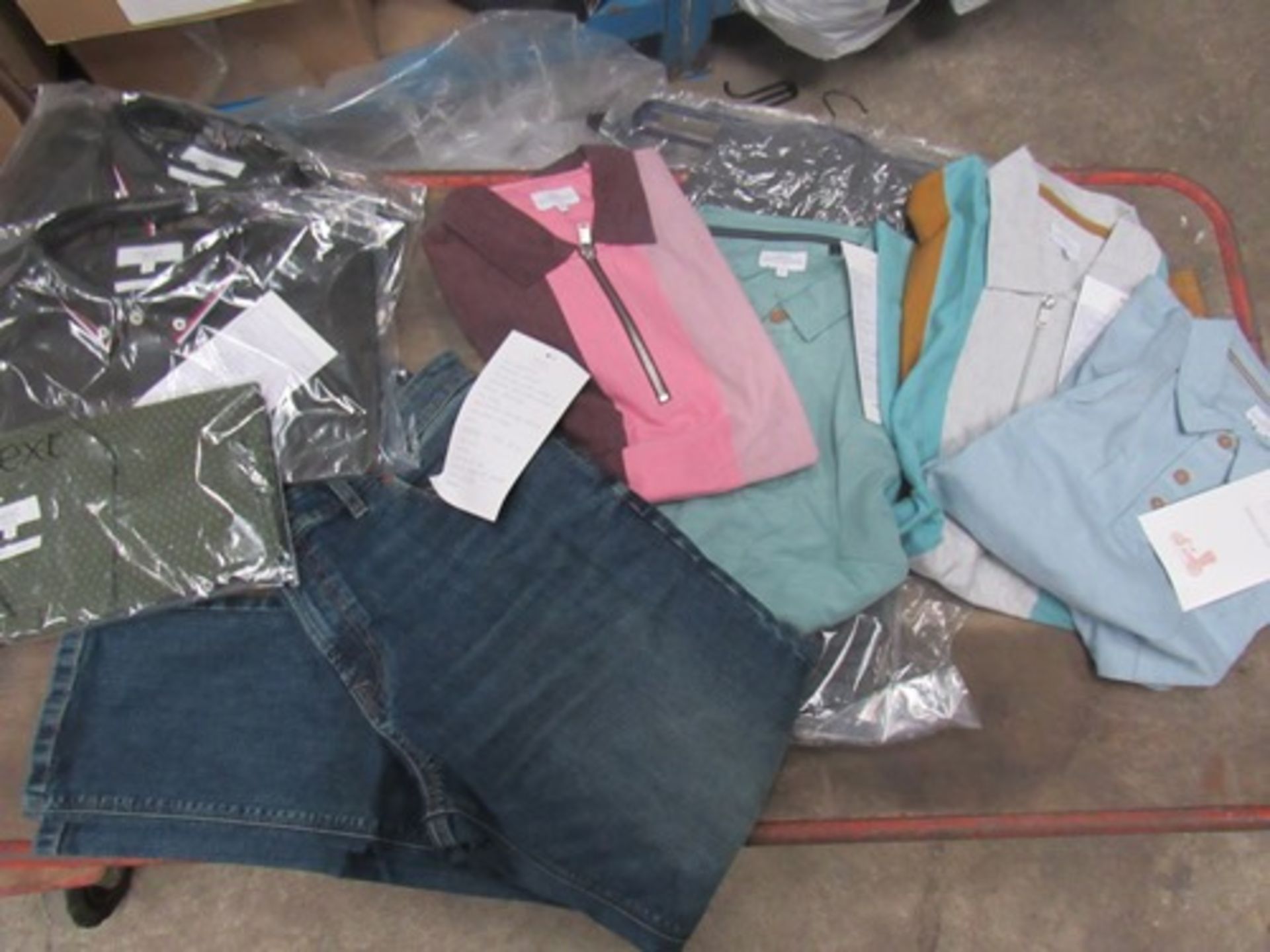 A quantity of men's Next sample clothing including jeans, and polo zip tops, all items complete,
