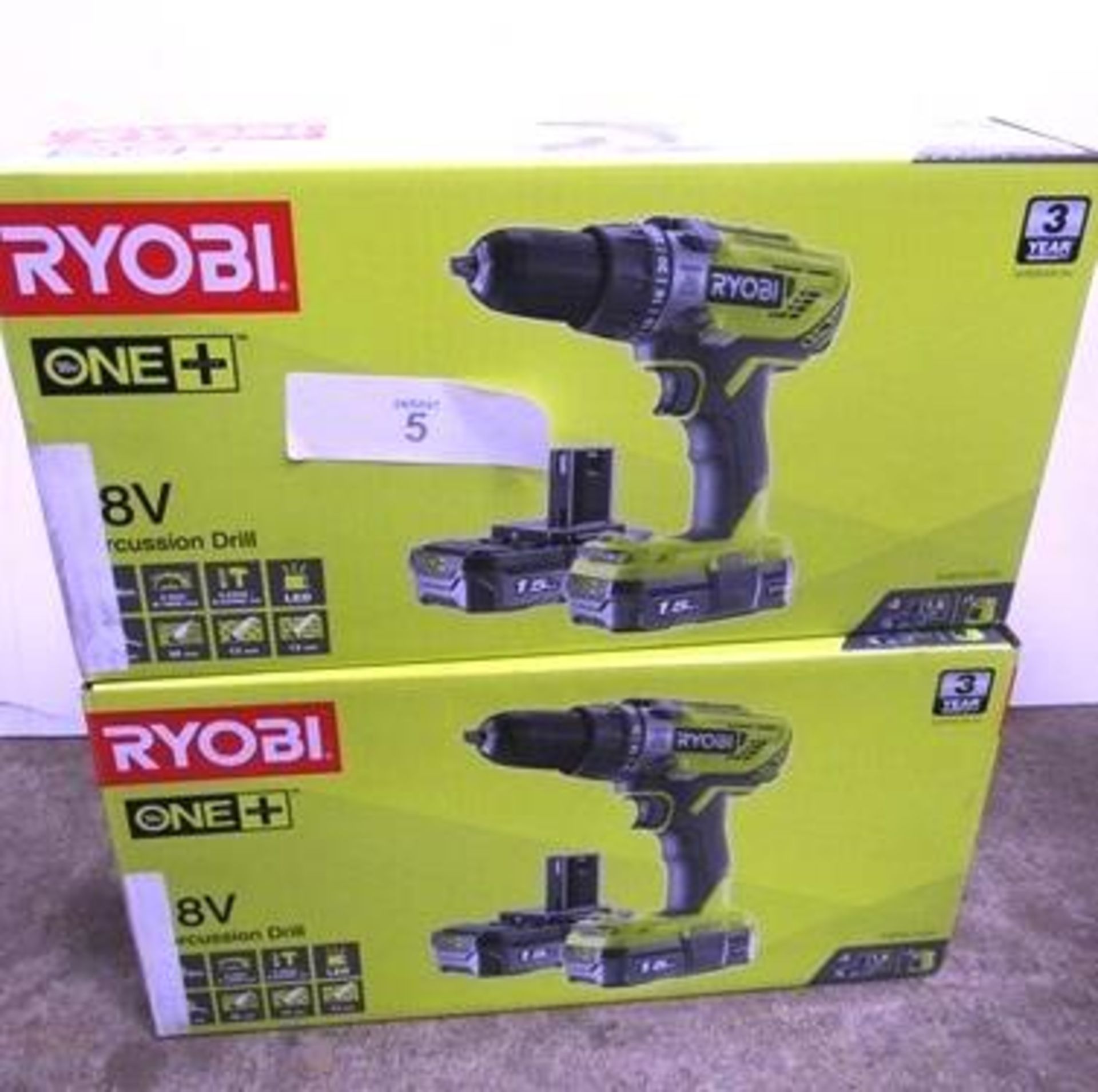 2 x Ryobi 18V percussion cordless drill sets each comprising 1 x drill, 2 x 1.5Ah batteries and 1