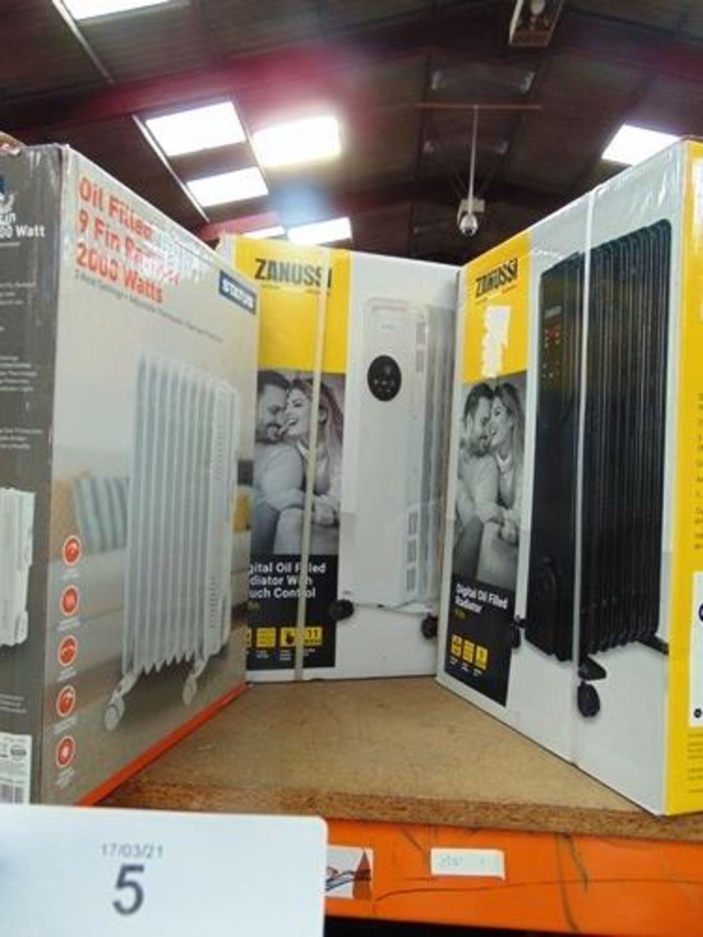 2 x Zanussi radiators comprising 1 x 11 Fin 2.3kw, model ZOFR5005 and 1 x 9 Fin 2kw, model ZOFR5003,