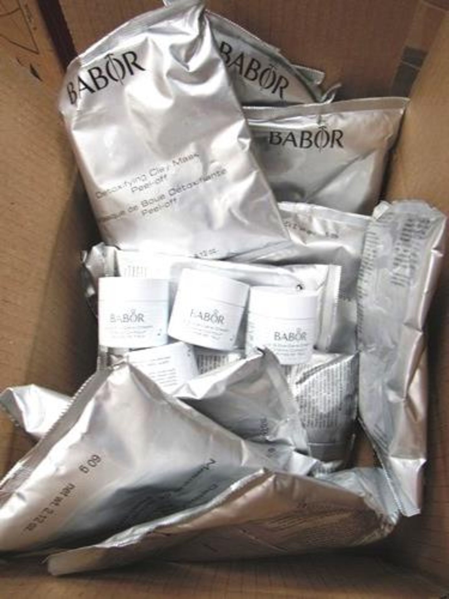 15 x 60g individual packs of Babor Peel-Off clay masks, 4 x 15g Babor lip & eye cream - New (C13C)