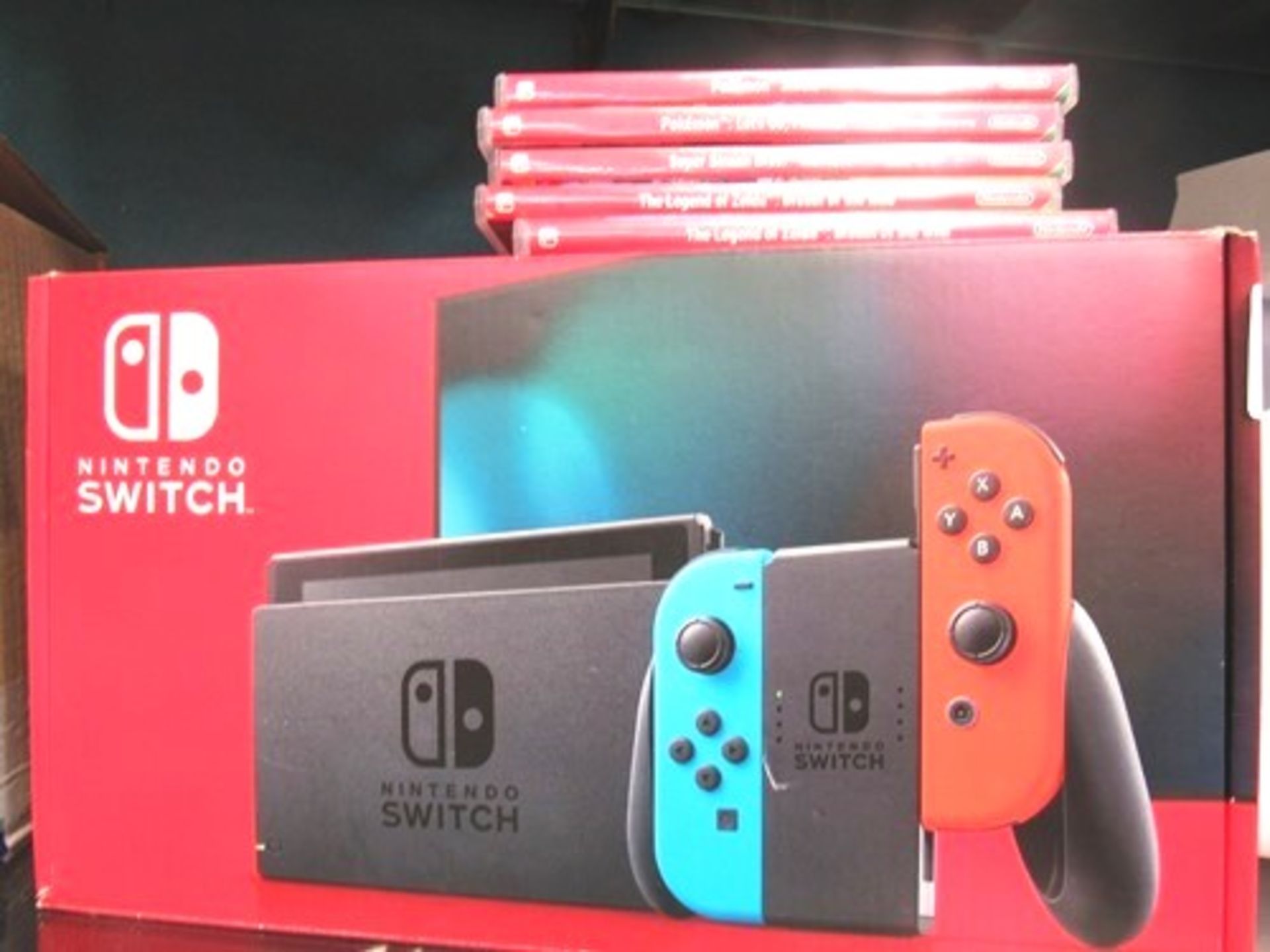1 x Nintendo switch games console, Ref No. XKJ40000702283 together with 5 x second-hand games