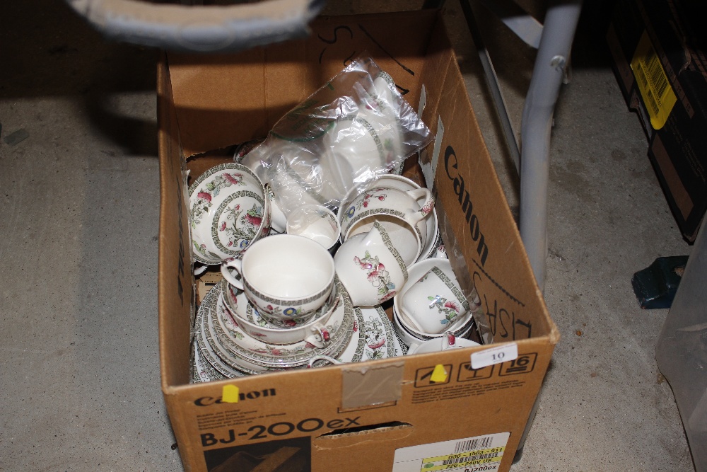 A box of "Indian Tree" pattern teaware