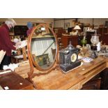 A mahogany swing framed toilet mirror