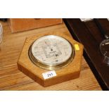 A S&M oak mounted barometer