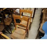 A pair of elm seated bar back chairs