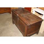 An oak and elm panelled coffer