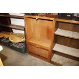 An oak Bowmans bookcase fitted cupboard below