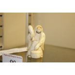 A signed ivory Netsuke of Noh Actor with revol