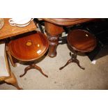 A mahogany and inlaid tripod wine table; and anoth