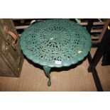 A small green metal garden table