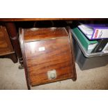 An Edwardian mahogany coal box