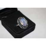 A boxed silver and opaline dress ring