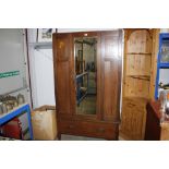 A mirror fronted single door wardrobe fitted singl