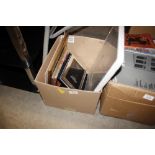 A box of various photo frames