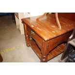 A hardwood coffee table fitted single drawer