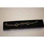 A silver and tigers eye set bracelet