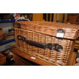 A wicker picnic hamper - lacking contents