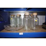 A quantity of glass storage jars and a glass bowl