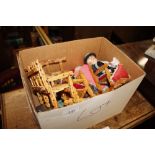 A box containing various dressed dolls, miniature