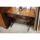 A small drop leaf table fitted two drawers