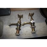 A pair of brass taps