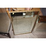 A gilt framed bevel glass wall mirror