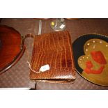 A lady's crocodile skin handbag