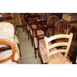 A set of four Victorian mahogany upholstered dining chairs