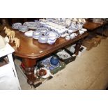 A Victorian mahogany extending dining table with t