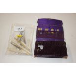 A bag of ivory and bone needlework items, hooks etc.