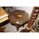 A carved oak octagonal topped table